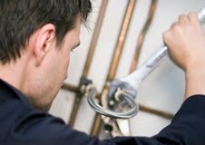 Plumber Fixing Water Heater